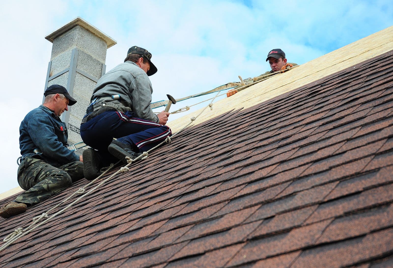 Workers doing roofing construction